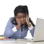black-african-american-ethnicity-frustrated-woman-working-stress-office-tired-as-secretary-work-desk-computer-50611421